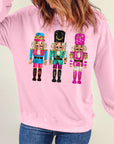 Sweat-shirt de Noël rose à épaules tombantes et imprimé casse-noisette mignon