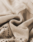 Sweat-shirt en tricot parcheminé avec bordure côtelée et coutures apparentes