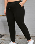 Black Plus Size Textured Exposed Seam Drawstring Jogger Pants - Toi ‘n’ Moi Ltd