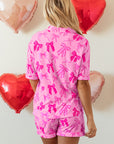 Set pigiama con camicia a maniche corte e pantaloncini con stampa fiocco rosa