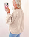 Sweat-shirt oversize à manches lanternes et nœud brodé en parchemin