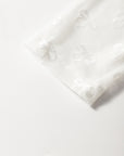 Haut à manches longues avec motif nœud en maille blanche