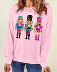 Sweat-shirt de Noël rose à épaules tombantes et imprimé casse-noisette mignon