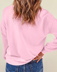Sweat-shirt de Noël rose à épaules tombantes et imprimé casse-noisette mignon