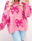 Pull ample à épaules tombantes et motif nœud rose