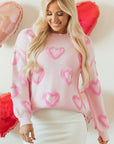 Pull ample à manches bouffantes en forme de cœur rose
