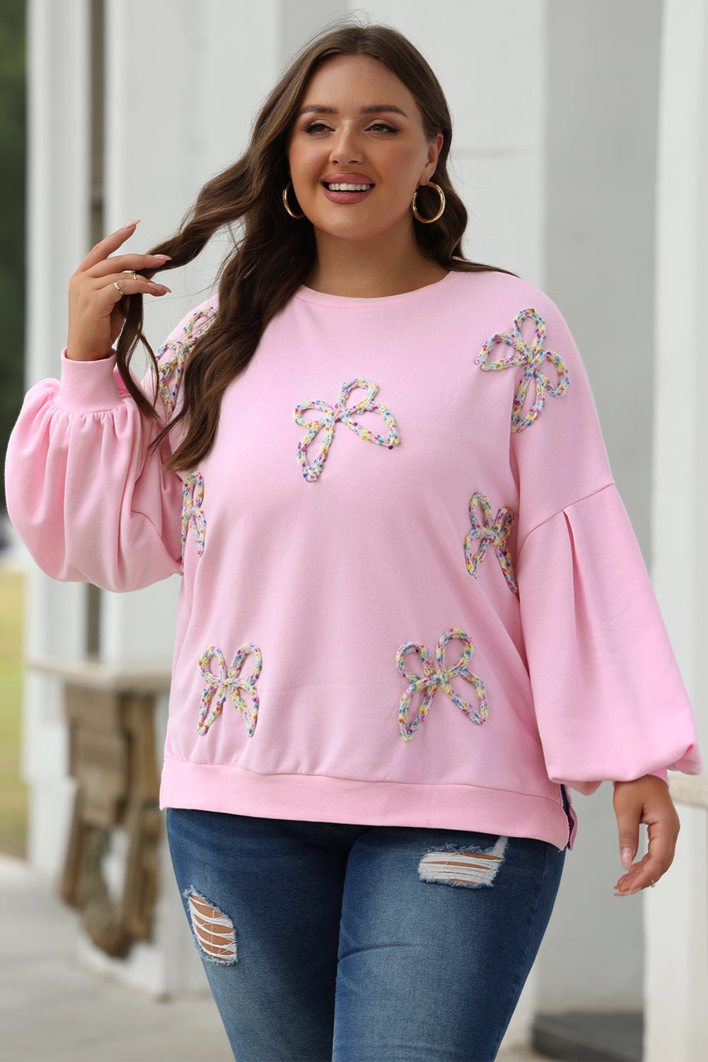 Felpa oversize con maniche a lanterna e fiocco ricamato rosa chiaro