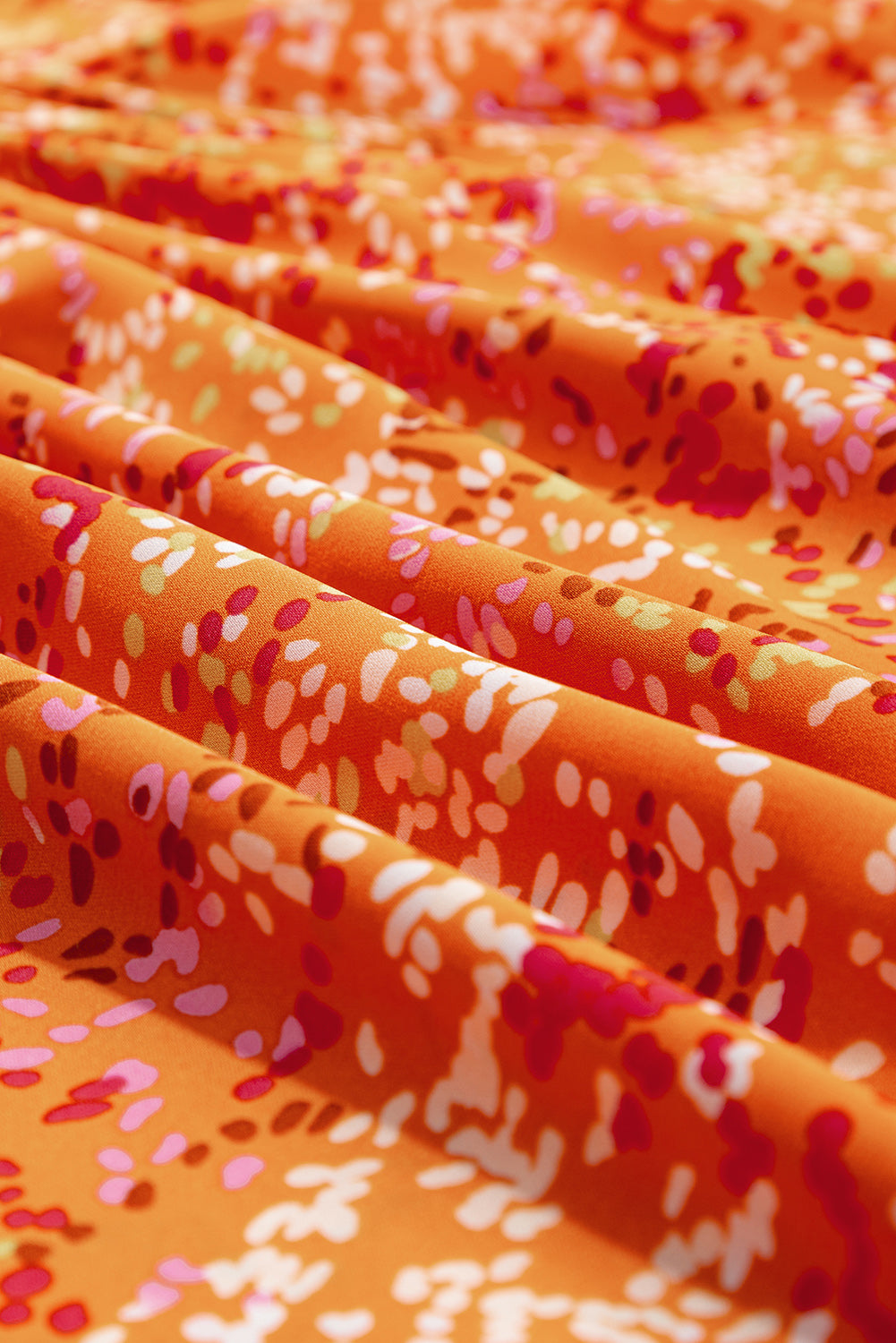Chemisier babydoll orange à imprimé abstrait et col en V