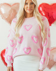 Pull ample à manches bouffantes en forme de cœur rose
