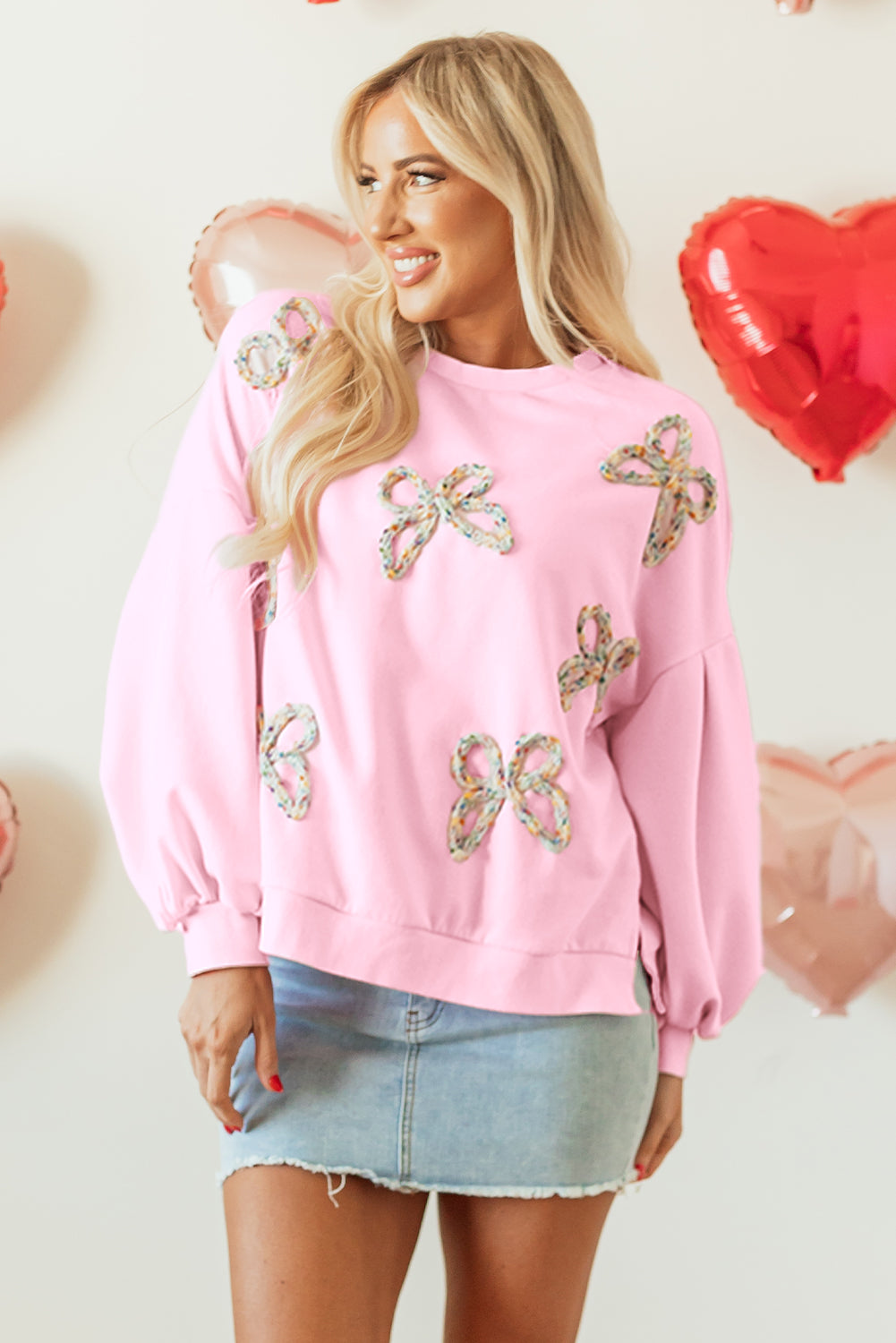 Felpa oversize con maniche a lanterna e fiocco ricamato rosa chiaro